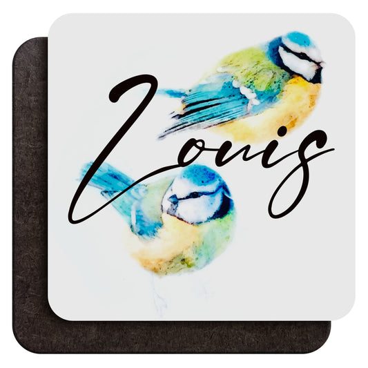 A glossy wood backed coaster shown from both sides, featuring two watercolour colourful blue tits and a personalised name, shown against a white backdrop
