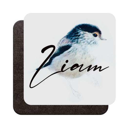 A glossy wood backed coaster shown from both sides, featuring a watercolour long-tailed tit bird art print and personalised name, shown against a white backdrop
