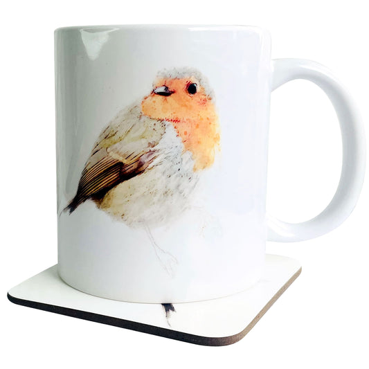 A glossy white ceramic mug with a watercolour robin bird art print on top of a wooden coaster featuring a matching print, shown against a white backdrop.
